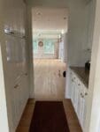 cherry floor white kitchen